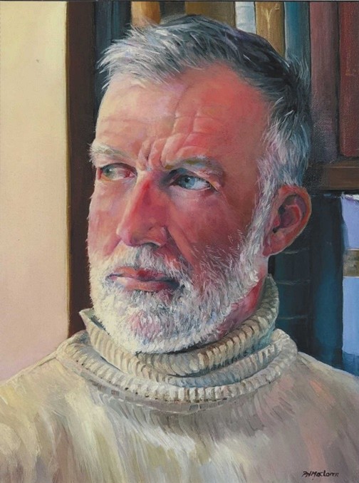 Head and shoulders of a man with grey hair and a white beard and moustache frowning to the side.